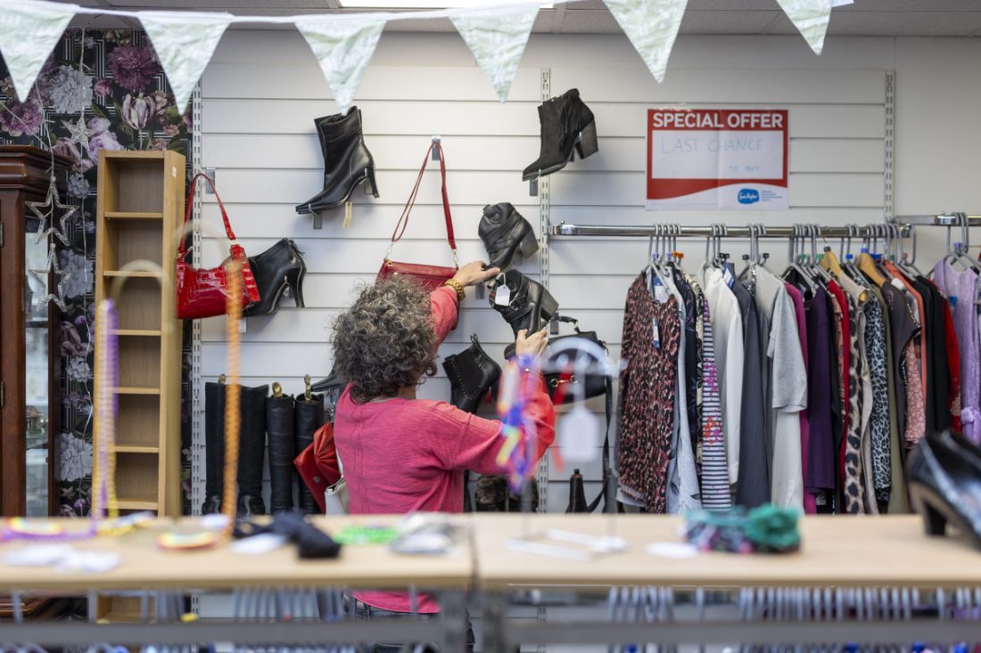 Woman working in charity shop