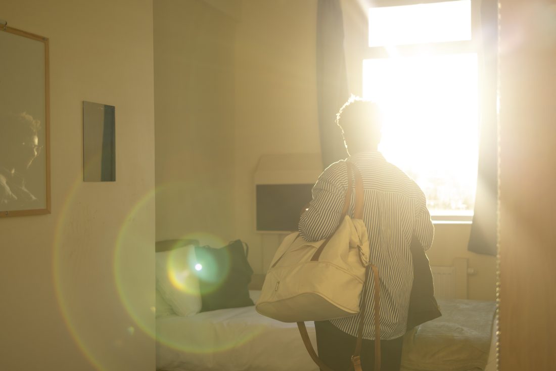 Woman entering a bedroom